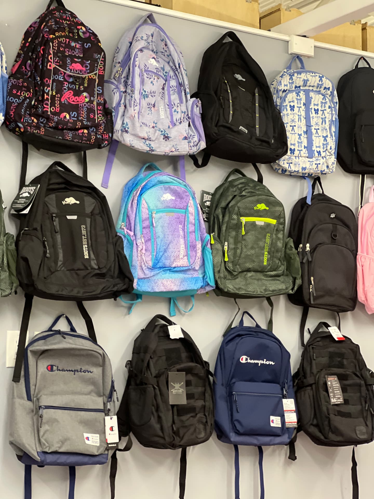 A wall of colourful backpacks ready for students