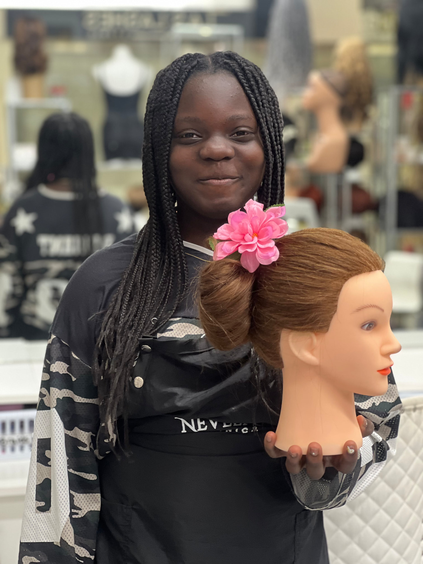 A young participant presents her completed creative styling