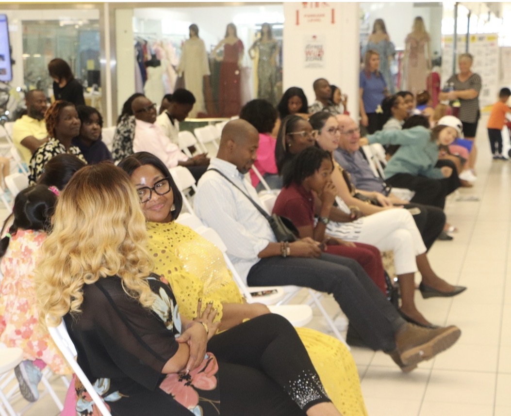Families and community members at a camp graduation celebration
