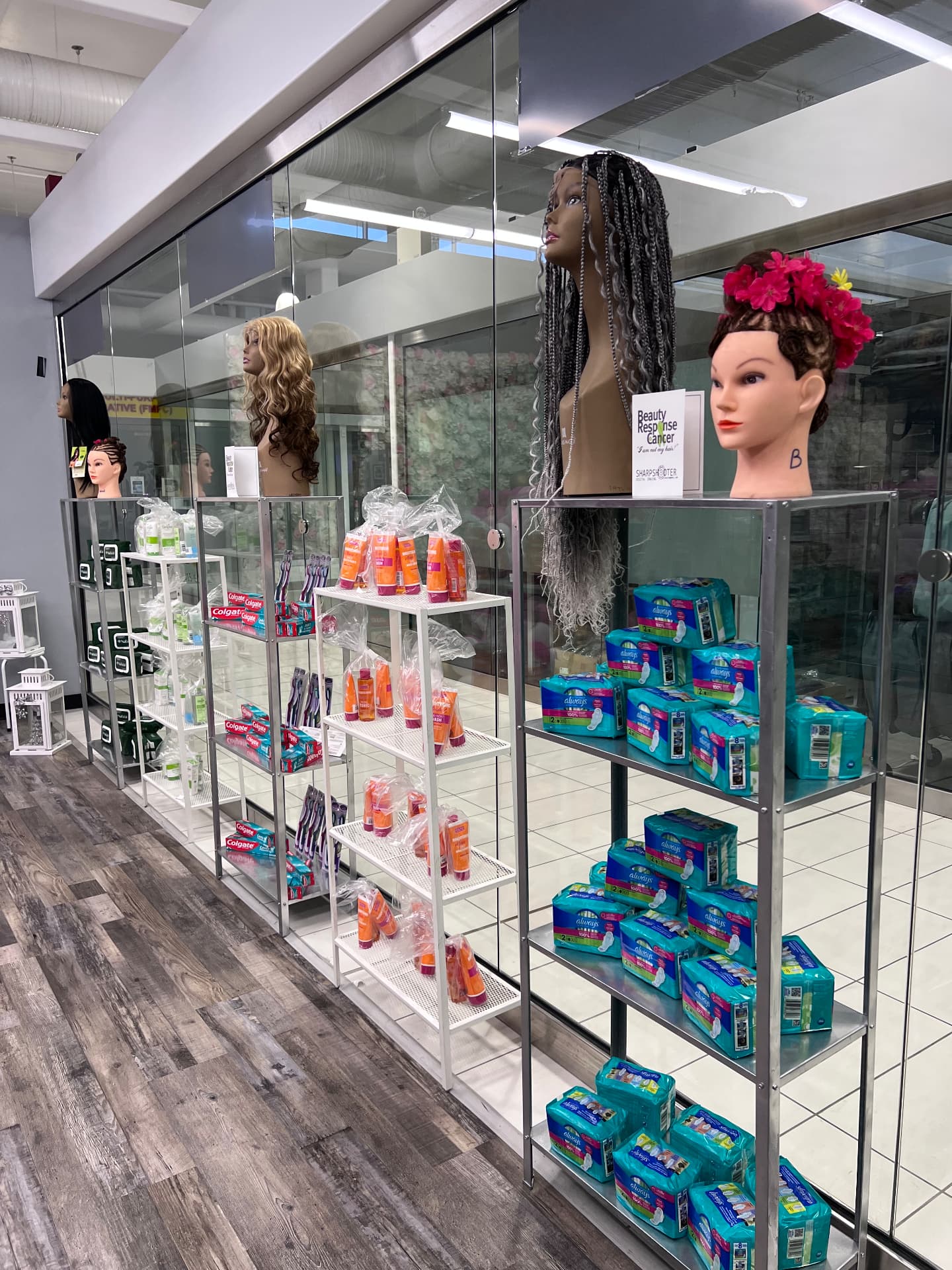 Shelves of personal care products beside a Beauty Response to Cancer sign