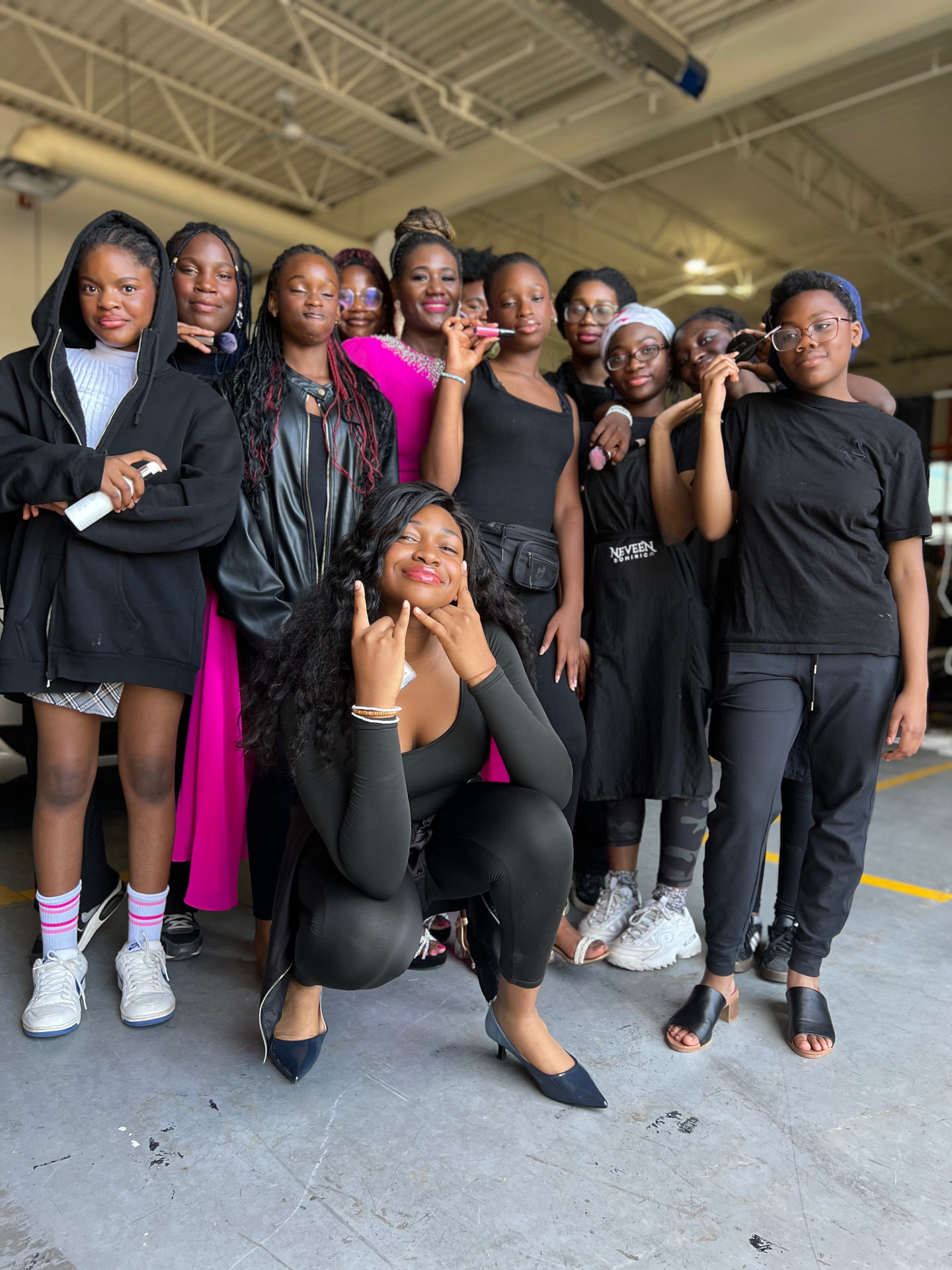 Campers gathered with their mentor after walking the stage as models and representatives of the backstage team