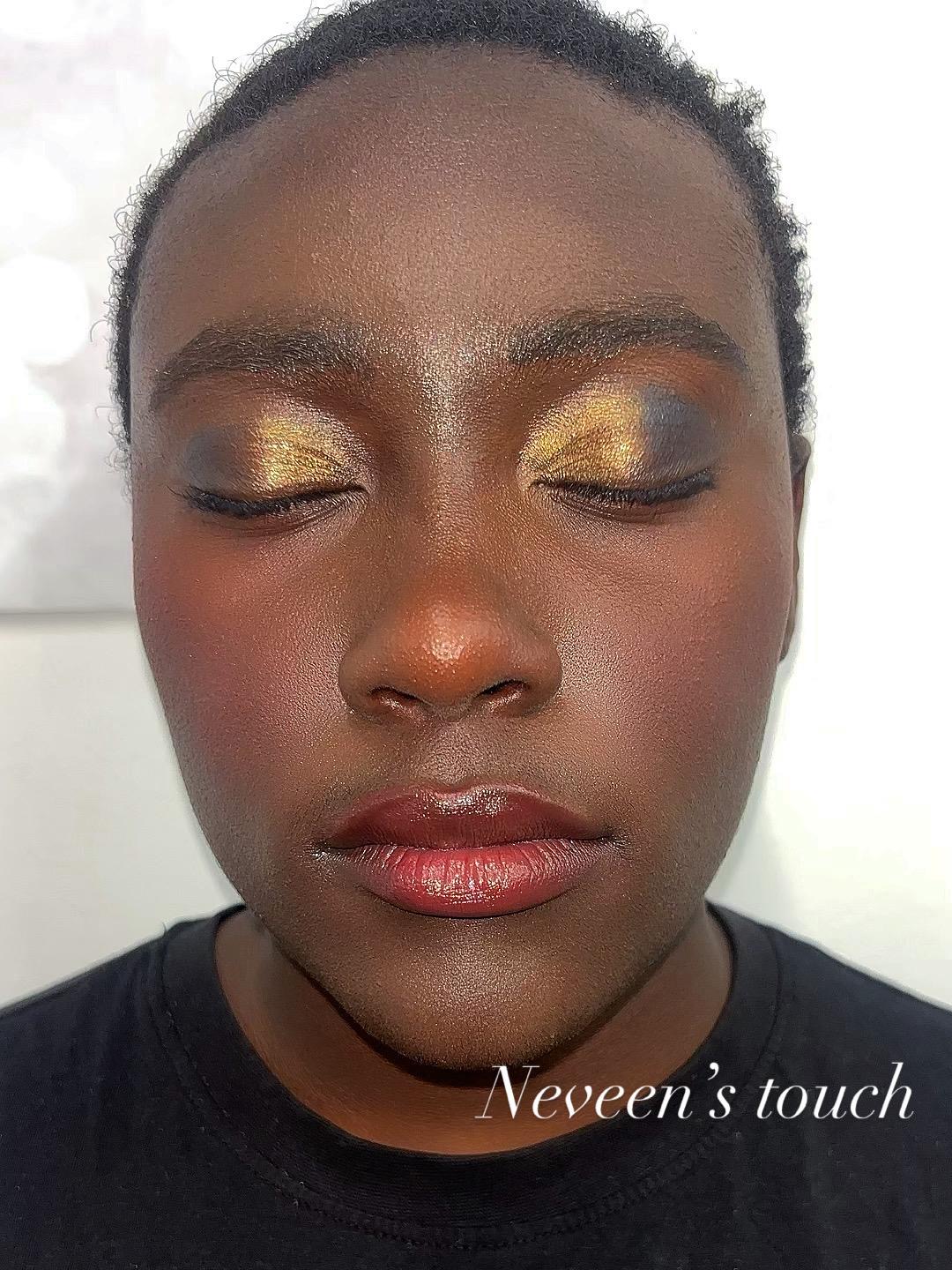 Close-up of finished golden eye makeup created during the camp