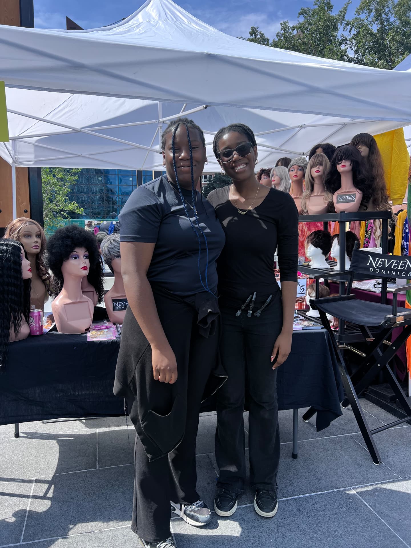 Two students smiling at the beauty booth